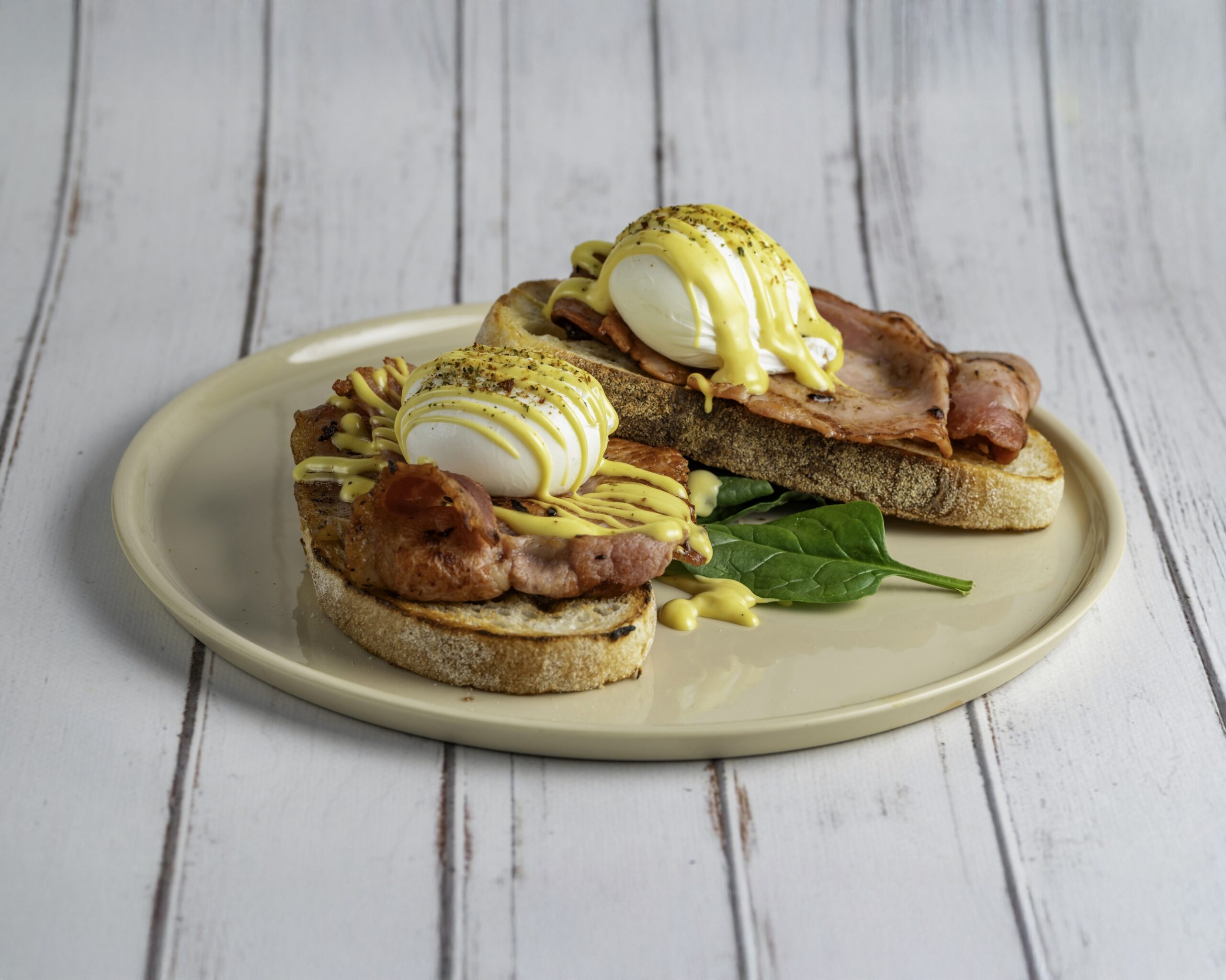 Benny Baby with poached eggs, bacon and hollandaise on sourdough